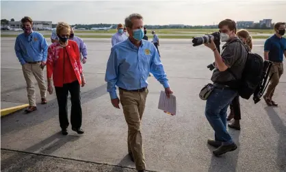  ??  ?? ‘Brian Kemp has joined the pro-mask chorus – but only because otherwise there might not be a college football season.’ Photograph: Erik S Lesser/EPA