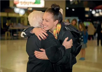  ?? PHOTO: GEORGE HEARD/FAIRFAX NZ ?? New Zealand’s most successful Paralympia­n, Sophie Pascoe, is greeted by her nana after arriving back home in Christchur­ch last night.