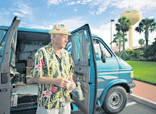  ?? COURTESY ?? Dennis Dean with the blue van that is his home at the Villages, the retirement community near Orlando featured in the documentar­y “Some Kind of Heaven.”