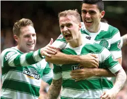  ??  ?? HAPPY BHOYS: Commons and Rogic congratula­te two-goal Griffiths