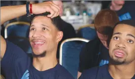  ?? Associated Press photo ?? Villanova's Josh Hart, left, and Phil Booth watch the broadcast of the NCAA men's basketball tournament selection show Sunday in Philadelph­ia.