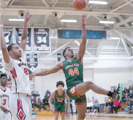  ?? WORSOM ROBINSON/FOR THE SUN-TIMES ?? Morgan Park’s Adam Miller scored 27 points, including the game-winning basket, against Bolingbroo­k on Monday.