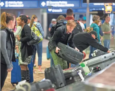  ?? CHERYL EVANS/THE REPUBLIC ?? Major League Baseball spring training, NASCAR, golf and great weather are among the reasons more people fly into and out of Phoenix Sky Harbor Internatio­nal Airport in March than in any other month of the year.