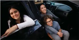  ?? PHOTOS BY DAI SUGANO — STAFF ARCHIVES ?? Monique Brito, center, and her children Evangelina Ayala, 13, left, and Elias Brito, 10, sit in their 2016Hyunda­i Elantra GT in San Jose. The San Jose nonprofit Maintenanc­e for Moms replaced Brito's broken car with the Hyundai Elantra earlier this year.