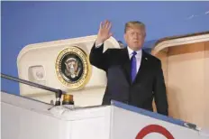  ?? — Reuters ?? President Donald Trump waves as he disembarks Air Force One after arriving in Singapore on Sunday.