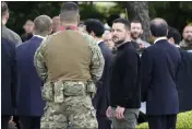  ?? EUGENE HOSHIKO — THE ASSOCIATED PRESS ?? Ukrainian President Volodymyr Zelenskyy, center front, waits for a car after laying flowers in front of the Cenotaph for the Victims of the Atomic Bomb at the Hiroshima Peace Memorial Park after he was invited to the Group of Seven (G7) nations' summit in Hiroshima, western Japan, on Sunday.