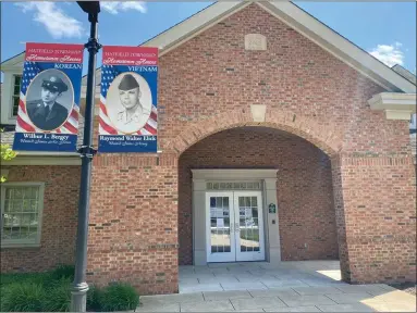  ?? SUBMITTED PHOTO COURTESY OF HATFIELD TOWNSHIP ?? “Hometown Hero” banners recognizin­g U.S. Air Force Korean War veteran Wilbur L. Bergey and U.S. Army Vietnam War veteran Raymond Walter Elick are seen outside the Hatfield Township municipal building on School Road on Wednesday, May 13.