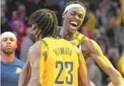  ?? DARRON CUMMINGS / ASSOCIATED PRESS ?? The Indiana Pacers’ Aaron Nesmith (23) and Pascal Siakam celebrate after Indiana defeated the Phoenix Suns on Friday.