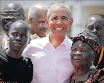  ?? PICTURE: EPA-EFE ?? Former US president Barack Obama poses for photograph­s with his step-grandmothe­r Sarah Onyango Obama and a local student, during an opening ceremony of the Sauti Kuu Sports, Vocational and Training Centre in his ancestral home, Kogelo, Kenya, yesterday. Obama visited his ancestral home in western Kenya to attend the opening ceremony of the centre founded by his half-sister Auma Obama.