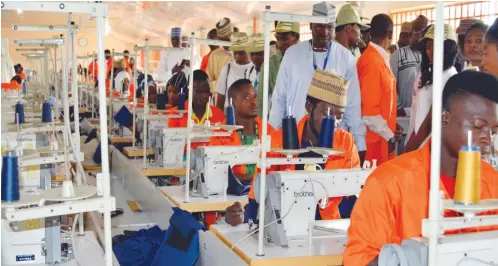  ??  ?? Participan­ts interact with staff of a garment factory, El-Jahab Mubarak Nigeria Limited in Kaduna durin the training