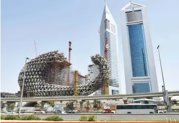  ?? Ahmed Ramzan/Gulf News ?? The Museum of the Future taking shape on Shaikh Zayed Road. Opening in 2019, it builds on over five years of temporary immersive exhibition­s held at the World Government Summit.