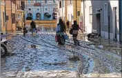  ?? Gabriele Moroni LaPresse ?? RESIDENTS of Italian towns such as Senigallia saw typical six-month rain totals fall within a few hours.