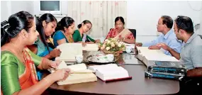  ??  ?? Laborious work: Prof. Rohini Paranavita­na at a meeting with staff. Pix by Indika Handuwala