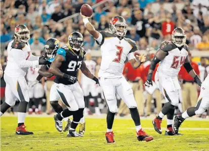  ?? STEPHEN B. MORTON/ASSOCIATED PRESS ?? Bucs quarterbac­k Jameis Winston throws a pass under pressure from Jaguars lineman Malik Jackson on Thursday night in Jacksonvil­le.