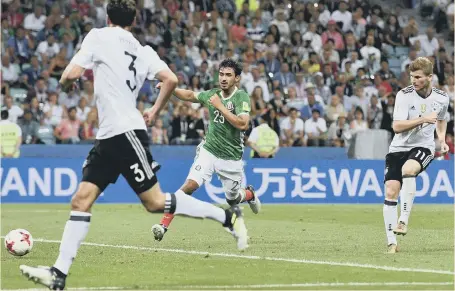  ??  ?? Timo Werner (right) hits home Germany’s third goal in last night’s Confederat­ions Cup semi-final victory over Mexico.