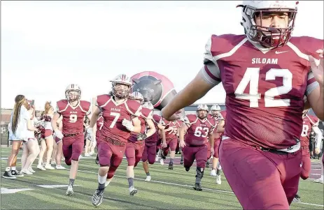  ?? Bud Sullins/Special to the Herald-Leader ?? The Siloam Springs football team runs through the tunnel before the 2019 season opener.