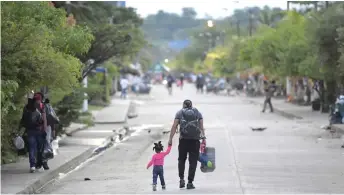  ?? ?? Stranded migrants from Haiti are seen on the streets of Necocli, Colombia.