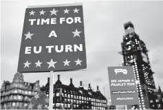  ??  ?? Anti-Brexit banners are seen during a demonstrat­ion outside the Houses of Parliament, ahead of a vote on Prime MinisterTh­eresa May’s Brexit deal, in London, Britain. — Reuters photo