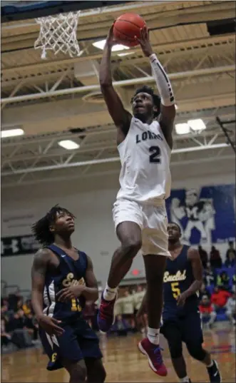  ?? RANDY MEYERS — FOR THE MORNING JOURNAL ?? Lorain’s Taevon Pierre-Louis goes in for a dunk against Euclid during the Bob DiFranco Classic on Dec. 1 at Midview.