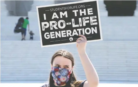  ?? NICHOLAS KAMM/AFP VIA GETTY IMAGES ?? An anti-abortion activist demonstrat­es in front of the U.S. Supreme Court in Washington, D.C., where justices rejected a Louisiana law that activists say would make abortions harder to obtain.