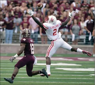  ?? AP PHOTO ?? Houston safety Khalil Williams (2) swats down a pass intended for Texas State wide receiver Tyler Watts.