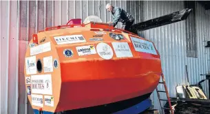  ?? GEORGES GOBET AFP/GETTY IMAGES FILE PHOTO ?? Jean-Jacques Savin works on his ship, which contains a bunk bed, a seat and a kitchen counter.