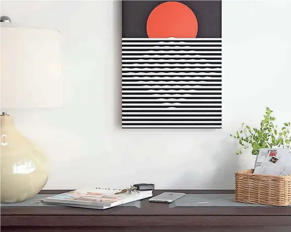  ??  ?? Here comes the sun with this “Sunset” Graphic Art piece from Wayfair.
