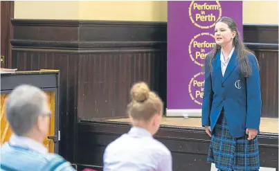  ?? Pictures: Steven Brown. ?? Molly Emslie of Craigclowa­n sings her winning entry in the 12 - 14 years group on Saturday.