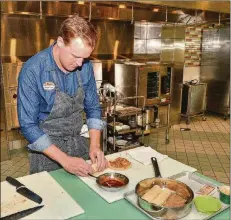  ?? PHOTOS CONTRIBUTE­D BY CHRIS HUNT ?? Chickfil-A chef Stuart Tracy shows a proper rolling technique for his Chicken Enchiladas from Scratch Chickfil-A meal kit.