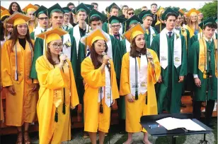  ?? Ernest A. Brown photo ?? Members of the Class of 2018 Senior Chorus sing “For Good” from the Broadway Show ‘Wicked’ during the ceremony Friday evening.