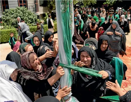  ?? ?? Shiite women in Kabul last week, marking part of Muharram, a month of mourning for Imam Hussein, grandson of the prophet Muhammad. Until the past two weeks, they were safe to gather outside, but a spate of terror attacks has led some community leaders to accuse the authoritie­s of ‘‘cancelling’’ the sacred rite instead of safeguardi­ng it.