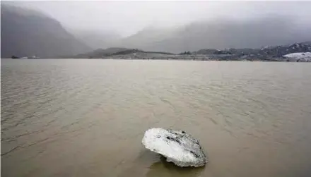  ?? AFP PIC ?? An ice floe floating on a lake in front of the Solheimajo­kull glacier in Iceland where the ice is retreating.