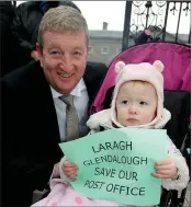 ??  ?? TD Pat Casey with his grandniece Kayleigh Casey-Murphy at the protest by supporters of Laragh post office outside the Dáil recently.