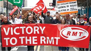  ?? ?? Ongoing protest: RMT members on a march through Glasgow during the summer