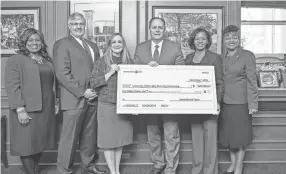  ?? MEMPHIS ?? Internatio­nal Paper is investing $1 million in University of Memphis’ River City Partnershi­p, the university announced. From left are Kandi Hill-Clarke, James McDonald, Alissa Campbell Shaw, University President M. David Rudd, Dynisha Woods and Karen Weddle-West. PHOTO BY TREY CLARK / COURTESY OF UNIVERSITY OF