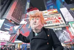  ?? AFP ?? Over 1,000 protesters gather in Times Square on Tuesday as part of national demonstrat­ions to demand an end to Mr Trump’s presidency.