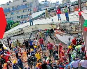  ?? —AP ?? Rescue workers search for children trapped inside the collapsed Enrique Rebsamen school in Mexico City