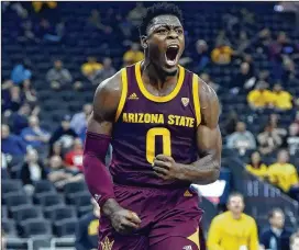  ?? DAVID BECKER / GETTY IMAGES ?? Arizona State freshman guard Luguentz Dort reacts after dunking the ball against Utah State earlier this season. Dort scored 33 points in the 87-82 win.
