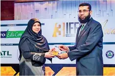  ??  ?? Amana Bank Chief Financial Officer Ali Wahid receiving the award for Islamic Finance Entity from INCIEF Associate Professor and Maldives Centre for Islamic Finance (MCIF) Chairperso­n Dr. Aishath Muneeza