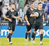  ??  ?? THUMPED Christoph Baumgartne­r, right, nets Austria’s first