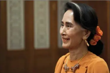  ?? NICOLAS ASFOURI — THE ASSOCIATED PRESS ?? Myanmar State Counsellor Aung San Suu Kyi meets with Chinese Premier Li Keqiang at the Great Hall of the People in Beijing. Myanmar was supposed to turn away from China and toward the West when the U.S. helped it transition from five decades of...