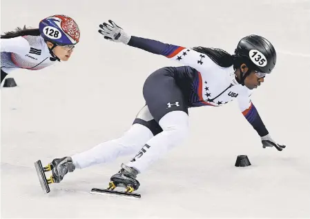  ?? JAMES LANG/USA TODAY SPORTS ?? Maame Biney, right, finished second in her heat Saturday to reach the quarterfin­als in the short-track 500 meters.