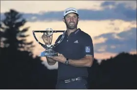  ?? CHARLES KRUPA — THE ASSOCIATED PRESS ?? Dustin Johnson holds the trophy after winning the Northern Trust on Aug. 23 at TPC Boston.