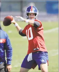  ?? Frank Franklin II / Associated Press ?? The Giants’ Eli Manning throws a pass during a minicamp at the team’s training facility Tuesday in East Rutherford, N.J.