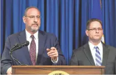  ?? CRAIG LASSIG, EUREOPEAN PRESSPHOTO AGENCY ?? U.S. Attorney Andrew Luger, left, and FBI Special Agent Richard Thornton discuss April 20 the arrest of six Minnesota men for conspiracy and attempt to provide support to the Islamic State.