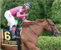  ?? JANET GARAGUSO/NYRA ?? Jockey Ricardo Santana Jr. celebrates aboard filly Got Stormy who became the first female horse to win The Fourstarda­ve (GI) at Saratoga Race Course Saturday afternoon.