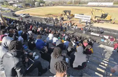  ?? STAFF PHOTO BY MATT HAMILTON ?? Students watch a groundbrea­king ceremony Tuesday for the new Tyner Middle High Academy.