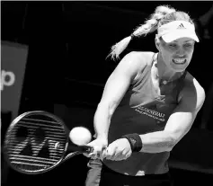  ??  ?? Kerber hits a return against Bouchard during their seventh session women’s singles match on day five of the Hopman Cup tennis tournament in Perth. — AFP photo