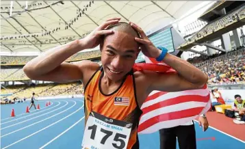  ??  ?? Go big, go bald: Rayzam Shah Wan Sofian shaved his head after winning the 110m hurdles gold medal at the Kuala Lumpur SEA Games in 2017.