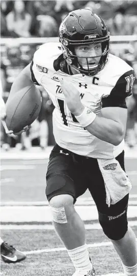  ?? MIKE GATHAGAN/TOWSON ATHLETICS ?? Towson quarterbac­k Tom Flacco’s running ability is considered one of his strengths.